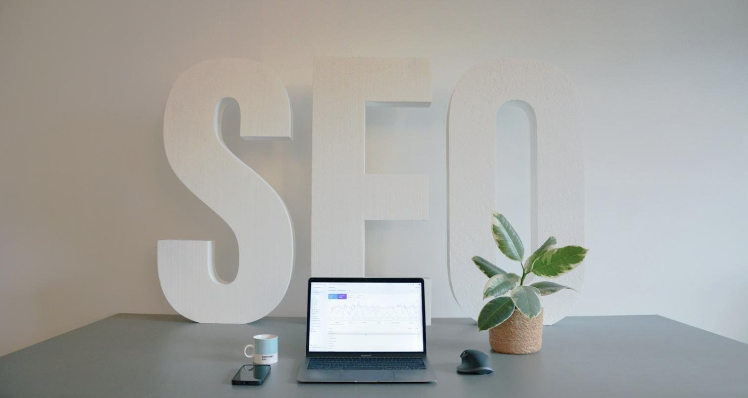 Top 10 SEO companies in Dubai — SEO letters and analytics on a desk | Gatsin